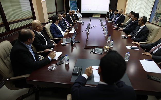Management reviewing a presentation in the boardroom